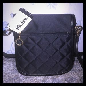 Cross-body bag with gold detailing.